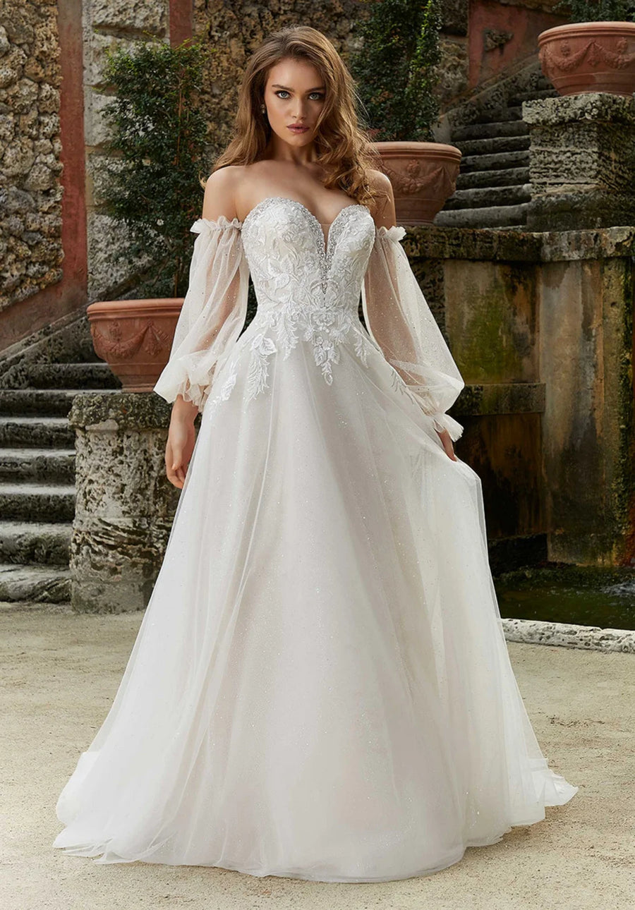 Beaded lace applique tulle A-line bridal gown, front view.