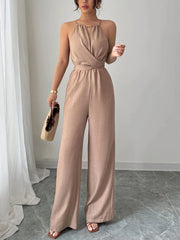 Chiffon halter neck maxi jumpsuit with a lace-up waist, front view