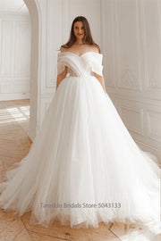 Strapless organza two-piece bridal gown with a court train, photo 2.